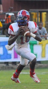 Linden quarterback Anthony Robinson looks to pass during the Patriots 39-13 win over the Leroy Bears in 2012.  (Photo courtesy of Laura Delegal)