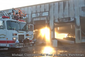 12-18-2012 -- Demopolis, Ala. -- Early morning sun reveals the damage caused by a fire at Newton Tire.