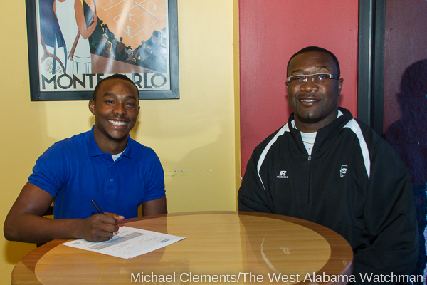 Anthony Robinson with Linden coach Andro Williams on National Signing Day 2013.