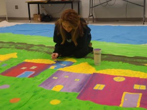 Holli Gandy works on the backdrop that will be used in the DHS adaptation of the Wizard of Oz. 