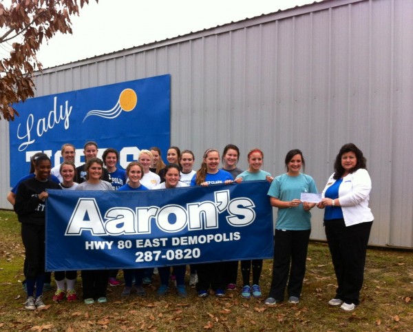 Aaron's of Demopolis presented the Demopolis High School softball team with a check for $1,000 as part of its donation to the program. 