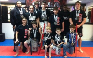 Pictured are Ross Martial Arts team members who competed at the 2013 NAGA Atlanta Championships (left to right): First row - Ronda Russell, Brett Schroeder, Jay Bell, Cameron Bell, Collin Morgan; Back row - Tony Nicholson, Jay Russell, Jackson Morrison, Tristen Fitz-Gerald, Hunter Compton, Terrell Johnson, and Lane Hawkins. Not pictured is Nikki Smith.