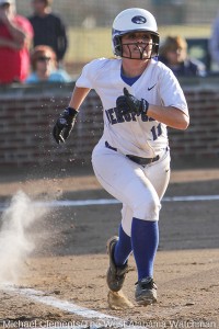 Olivia Brame kicks up some chalk and dust on her way to first base in the Tigers win over hale County.
