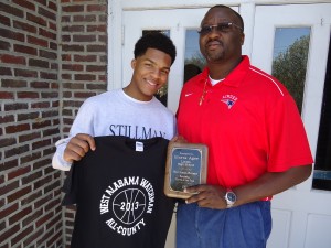 Imoras Agee, pictured here with Linden High principal Dr. Timothy Thurman, received a plaque and commemorative T-shirt honoring him as The West Alabama Watchman Boys Basketball Player of the Year for the 2012-2013 season. 