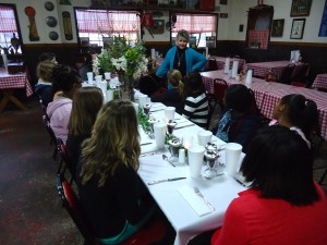 Kitty Eddins instructs the DMS Girl Power group on various aspects of etiquette during a session at Smokin' Jack's Monday afternoon. 