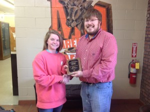 (Photo by Raycelia McIntyre) Marengo Academy junior guard Chandler Stenz receives the West Alabama Watchman Girls Basketball Player of the Year plaque from managing partner Jeremy Smith. 