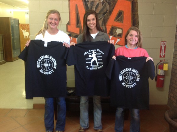 (Photo by Raycelia McIntyre)  Andrea Edmonds, Brooke Smyly and Chandler Stenz show off the T-shirts commemorating their status as West Alabama Watchman All-County players. 