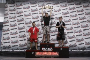 Brett Schroeder, 11, holds up the NAGA championship belt he won in the expert no gi division at NAGA Nashville on April 6.