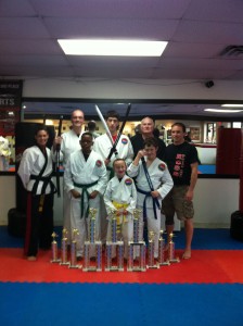 Ross Martial Arts Academy TKD Fight Team(Left to right): Front row - Cordell Washington, Charlie Duke, and Brett Schroeder; Back row - Ronda Russell, Jake Duke, Tristen Fitz-Gerald, Ron Ross, and Jay Russell.