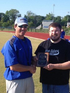 (Photo by Kevin May) Demopolis coach Ben Ramer (left) accepts the West Alabama Watchman Coach of the Year plaque from WAW managing partner Jeremy D. Smith Tuesday.