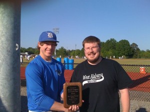 Demopolis High senior Mason Rogers accepts the West Alabama Watchman Player of the Year plaque from WAW managing partner Jeremy D. Smith. 