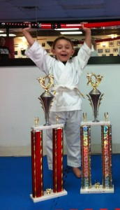 Ross Martial Arts Tiger Cub student Dylan Russell poses with the trophies and sword he won at the Alabama Karate Circuit Open on May 18.