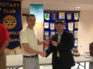 Outgoing Demopolis Rotary Club President Rob Fleming ceremonially passes the gavel to incoming president Rob Pearson Wednesday afternoon, signifying the official closure of the club's year.