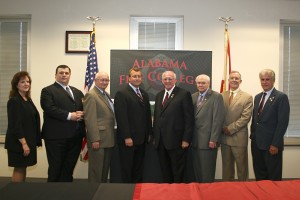 Representatives of the Alabama Fire College and Personnel Standards Commision met with representatives of the University of West Alabama on Monday to commemorate the signing of an agreement that enables UWA to offer academic degree credit to students at AFC. Students will be allowed to transfer up to approximately 40 hours of training toward a bachelor's degree in technology in the new program that will launch with the fall semester beginning in August. Pictured left to right are Mary Beth Finn, AFC accreditation advisor; Reid Vaughan, AFC region coordinator; Commissioner and State Fire Marshal Ed Paulk; and AFC Executive Director Allan Rice with UWA's President Dr. Richard Holland; Provost Dr. David Taylor; College of Business Dean Dr. Ken Tucker; and Associate Dean Dr. Wayne Bedford.