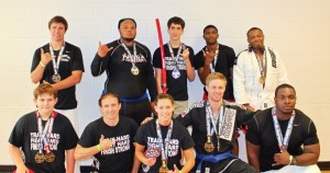 Members of the Ross Martial Arts Fight Team pose with their medals won at the Georgia State Championships. Pictured are (left to right): Front row - Hunter Compton, Jay Russell, Ronda Russell, Daniel Alexander, and Joe Morris; Back row - Ty Harwell, Tony Nicholson, Tristen Fitz-Gerald, Robbie Gray, and Franklin Richardson.
