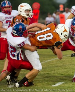 Hayden Huckabee (18) drags a South Choctaw defender.