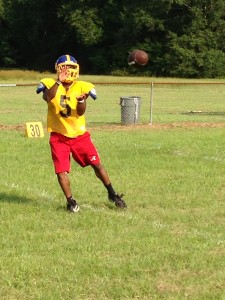Senior D.J. Bennett sets to haul in a pass during Tuesday's practice.