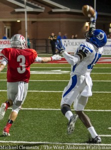 Cortez Lewis makes a one-handed, over-the-shoulder catch in the Tigers' game against the Saraland Spartans.