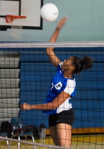 Ivery Moore goes up for a kill against Sumter Central.
