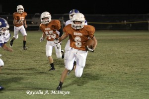 Gavin Tate carries the ball against the Southern Academy Cougars as the Jr. Longhorns added another victory to their record. 