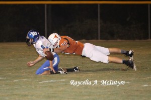 Carson Huckabee, #50, forces a fumble as he tackles a Wilcox Wildcat.