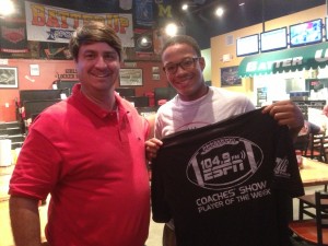 Sean Parker of ESPN 104.9 presents a commemorative Player of the Week T-shirt to Choctaw County High's Jamarcus Ezell Tuesday at Batter Up during the ESPN 104.9 Coaches Show.