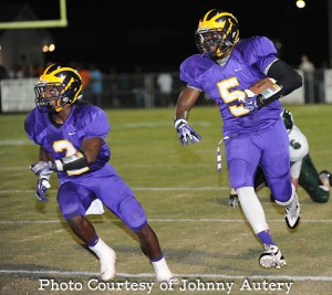 Jakoby Aldridge (2) leads Demarcus Gamble (5) for big yards as the Dawgs blow away   the Hurricanes 55-13