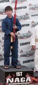 Collin Morgan poses with the championship sword he won in the 8-9 year-old intermediate boys middleweight division at the NAGA Southeast Regional Championships in Atlanta, GA.