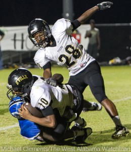 Hollis Bright brings down the Greenville quarterback in the end zone for a safety.