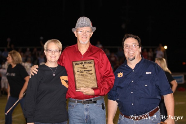 Mrs. Mellissa Trotter Hasty and Mr. David Pritchett present a plaque to Mr. Lee Bozeman. Mr. Bozeman served as band director from 1973-79 and 1981-89.