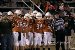 Before the coin toss, the official had the captains wave to the camera!