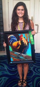 Kate Floyd shows off the rooster painting that won her first place in the Acrylic Painting competition at the State Convention.
