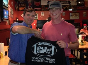 ESPN 104.9 West Alabama Coaches Show host Rob Pearson presents a commemorative Player of the Week T-shirt to Hayden Huckabee of Marengo Academy Tuesday night at Batter Up Sports Grill in Demopolis. 