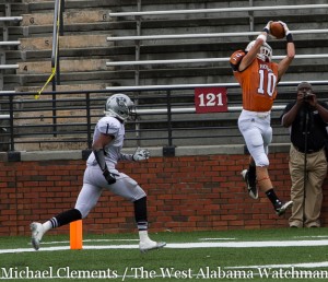 Alston Dinning makes a leaping interception in the end zone against Restoration Academy.