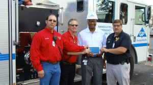 Pictured are Linden volunteer firemen Milton Vick and Mike Carlisle, GP Mill Manager Kelvin Hill, and Chief Scott McClure, Linden Police Department.