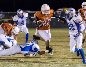 Josh Holifield leaps over a would be Chambers tackler.