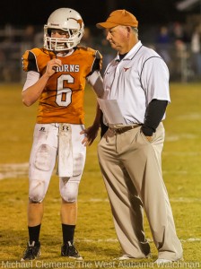 Robby James talks with Tyler Barkley during the 2013 season, one week before the Longhorns won the Class A state championship game.