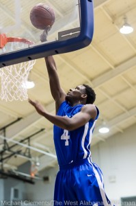 Nicholas Rogers goes up for a shot against John Essex Friday.