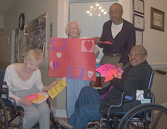 Karen Kincaid, Trice Smith, Bill Johnson, and Josephine Johnson receive Valentine’s Day cards made by local students. 