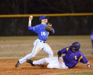 (Photo by Johnny Autery) Demopolis second baseman Matt Eicher steps on the bag and fires to first to turn a 5-4-3 double play during Monday's season-opening game at Sweet Water High School.