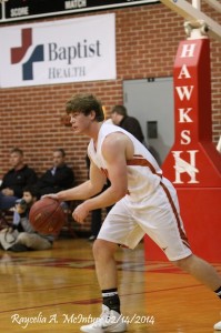 Hayden Huckabee works the ball up the floor against Chambers Friday.