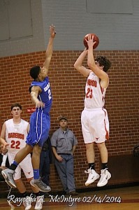 Q.D. Tinsley of Chambers Academy skies in an effort to block the jumper of Carson Huckabee.