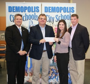 Demopolis City Schools Superintendent Dr. Al Griffin and Demopolis High Principal Dr. Tony Speegle bookend the photo as Trustmark Bank's Valley Harrison presents a donation check for the DHS Finance and Insurance Academy to Kelly Gandy.