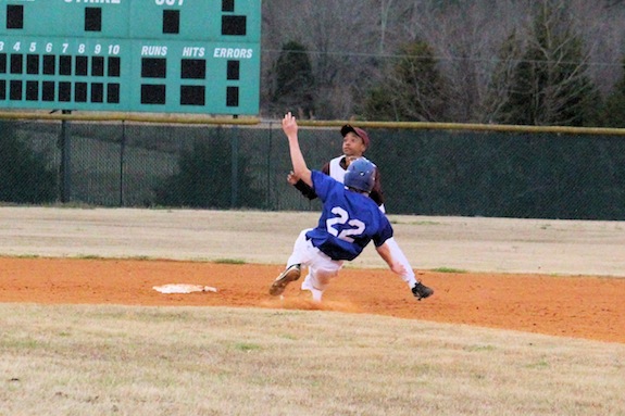 Wesley Allgood slides into second base for Demopolis Middle School.