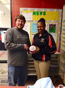 Marengo High's Alesia Bowser receives a commemorative mini-basketball from West Alabama Watchman managing partner Jeremy D. Smith for being named the WAW Player of the Year.