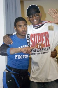 Tre Jones (left) poses with teammate Larry Cobb in the locker room of Bryant-Denny Stadium following the Demopolis High Tigers' 2009 Class 5A state championship win. Jones drowned during a riverboat sorority party in April 2012.