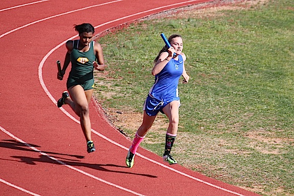 Audrey Boykin completing the third leg of the girls 4x800-meter relay team which won the event.
