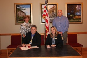 Dr. Al Griffin, Demopolis City Schools superintendent, and Dr. Kathy Chandler, dean of UWA's Julia S. Tutwiler College of Education, sign the UWA Teacher Connect agreement for Demopolis City Schools. Also pictured are Lisa Compton, online recruiting director, and Byron Thetford, online admissions counselor at UWA.