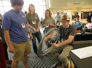 Sumter Academy student Dean Basinger (right) learns about gyroscopic stability as (L-R) Cole Rutherford, Shelby Fast and Kerri Giles look on.