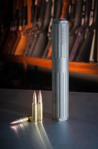 The suppressor may be useful for hunters who use rounds like the .223, shown beside the suppressor for feral-hog control and wildlife-management practices.